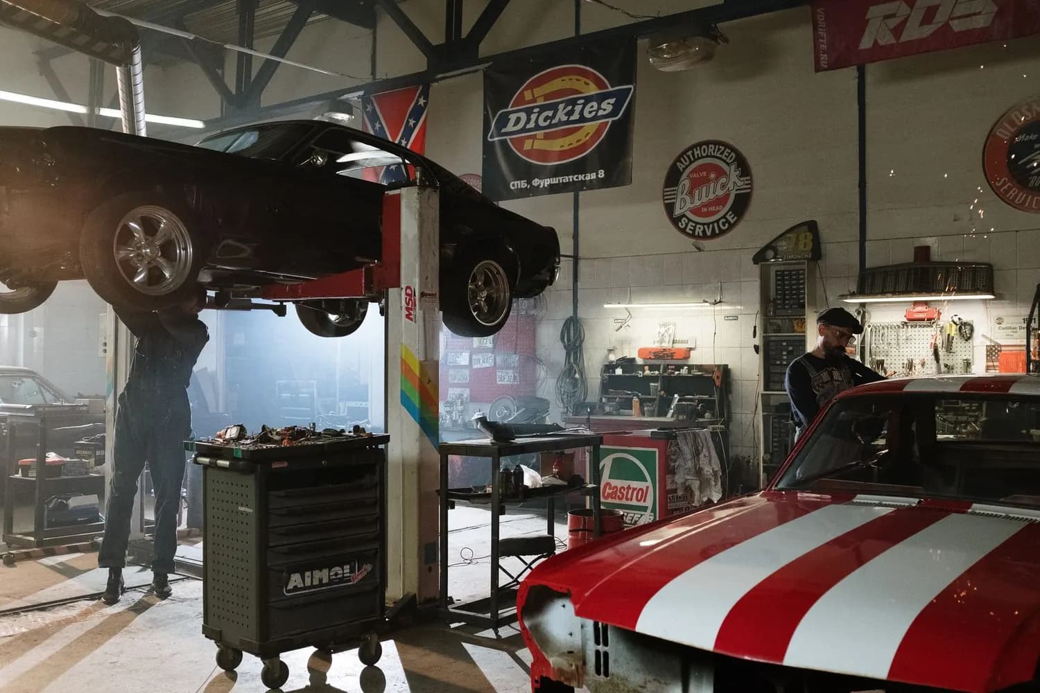 Car raised in a workshop bay
